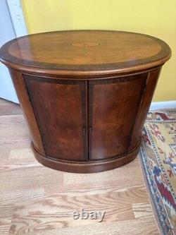 A Chippendale style oval shaped chairside chest by HERITAGE